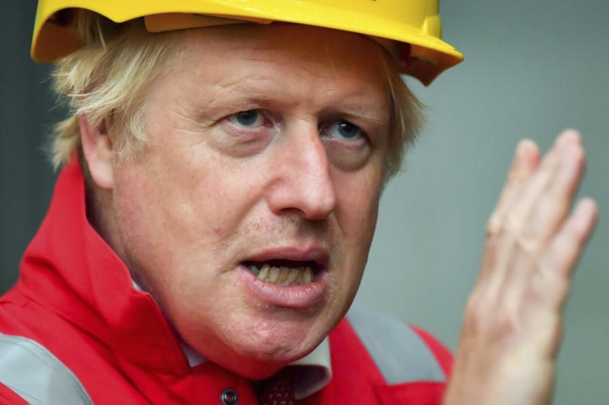 Britain&#039;s Prime Minister Boris Johnson gestures, during his visit to Appledore Shipyard in Devon, England, Tuesday, Aug. 25, 2020.