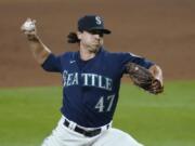 Pitcher Taylor Williams worked his way through trouble in the ninth to close out the Mariners&#039; 6-4 win Wednesday.