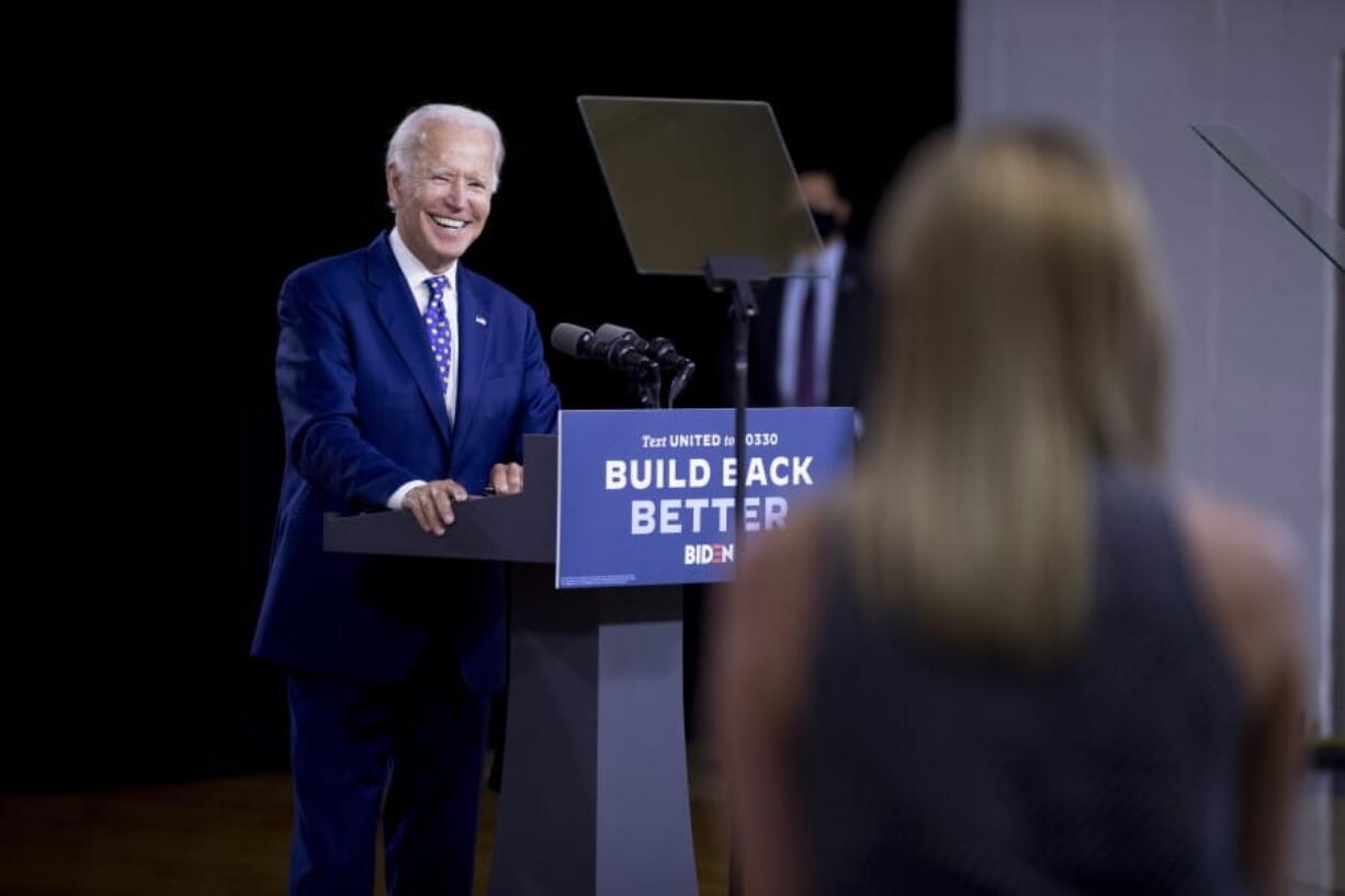 Democratic presidential candidate former Vice President Joe Biden smiles as he takes a question from a reporter at a campaign event at the William &quot;Hicks&quot; Anderson Community Center in Wilmington, Del., Tuesday, July 28, 2020.(AP Photo/Andrew Harnik)