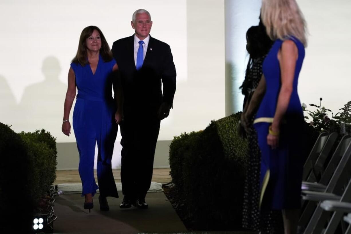 Vice President Mike Pence and second lady Karen Pence arrive to listen to first lady Melania Trump to speak during the 2020 Republican National Convention from the Rose Garden of the White House, Tuesday, Aug. 25, 2020, in Washington.