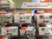 FILE - In this Aug. 5, 2020, file photo vote-by-mail ballots are shown in U.S. Postal service sorting trays the King County Elections headquarters in Renton, Wash., south of Seattle. The U.S. Postal Service has sent letters to 46 states and the District of Columbia, warning it cannot guarantee all ballots cast by mail for the November election will arrive in time to be counted, The Washington Post reported Friday, Aug. 14. (AP Photo/Ted S.