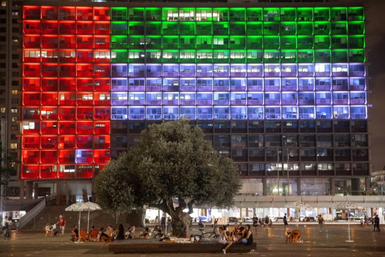 FILE - In this Aug. 13, 2020, file photo, Tel Aviv City Hall is lit up with the flag of the United Arab Emirates as UAE and Israel announced they would be establishing full diplomatic ties, in Tel Aviv, Israel.Iran&#039;s powerful Revolutionary Guard vowed on Saturday, Aug. 15, 2020 that there would be dangerous consequences for the United Arab Emirates after it announced a historic deal with Israel to open up diplomatic relations.