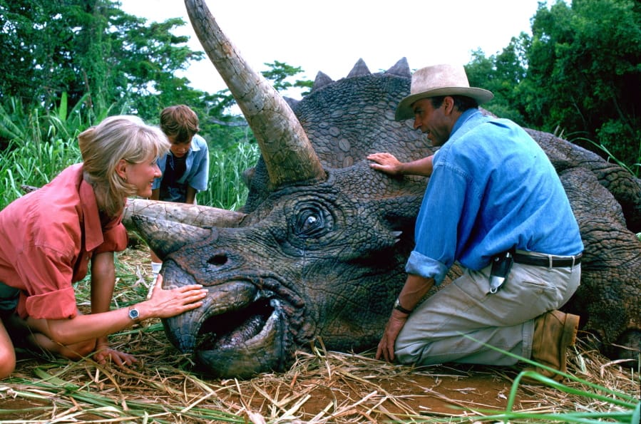 This image released by Universal Pictures shows, from left, Laura Dern, Joseph Mazzello and Sam Neill in a scene from the 1993 film &quot;Jurassic Park.&quot; With all major new releases postponed until at least Labor Day weekend due to the pandemic, summer moviegoing has belonged to the classics. &quot;Jurassic Park&quot; has led them all with a bit more than $3 million in ticket sales this summer, according to several people who have seen box-office grosses.