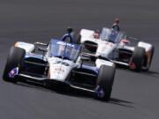 Takuma Sato, of Japan, leads Marco Andretti into turn one during the Indianapolis 500 auto race at Indianapolis Motor Speedway, Sunday, Aug. 23, 2020, in Indianapolis.