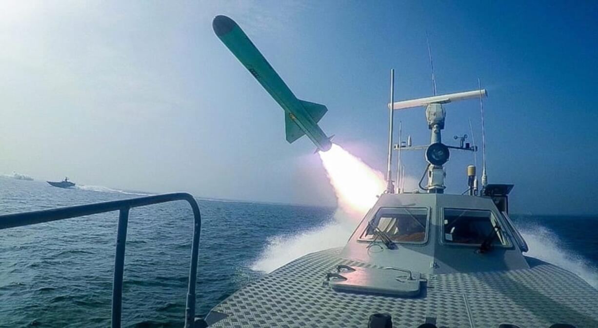 In this photo released July 28, a Revolutionary Guard speed boat fires a missile during a military exercise. The drill appeared aimed at threatening the U.S. amid tensions between Tehran and Washington.