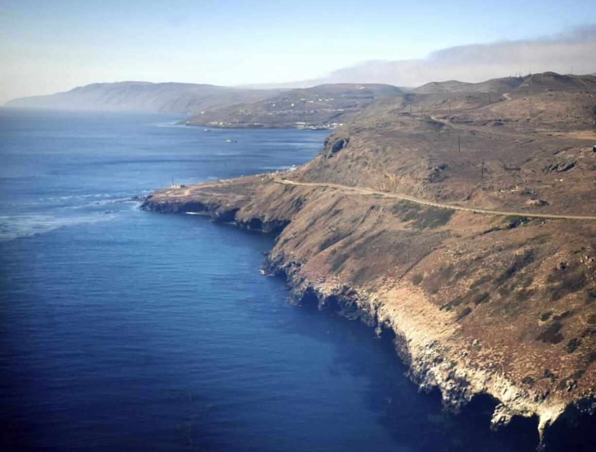 In this July 16, 2013, photo is an aerial view of the coast and Pacific Ocean taken flying in to San Clemente Island, in San Diego. A military seafaring assault vehicle that sank off the coast of Southern California with Marines and one Navy corpsman on board is under hundreds feet of water, making it impossible for divers to reach the landing craft and complicating rescue efforts for the missing troops, officials said Friday, July 31, 2020.