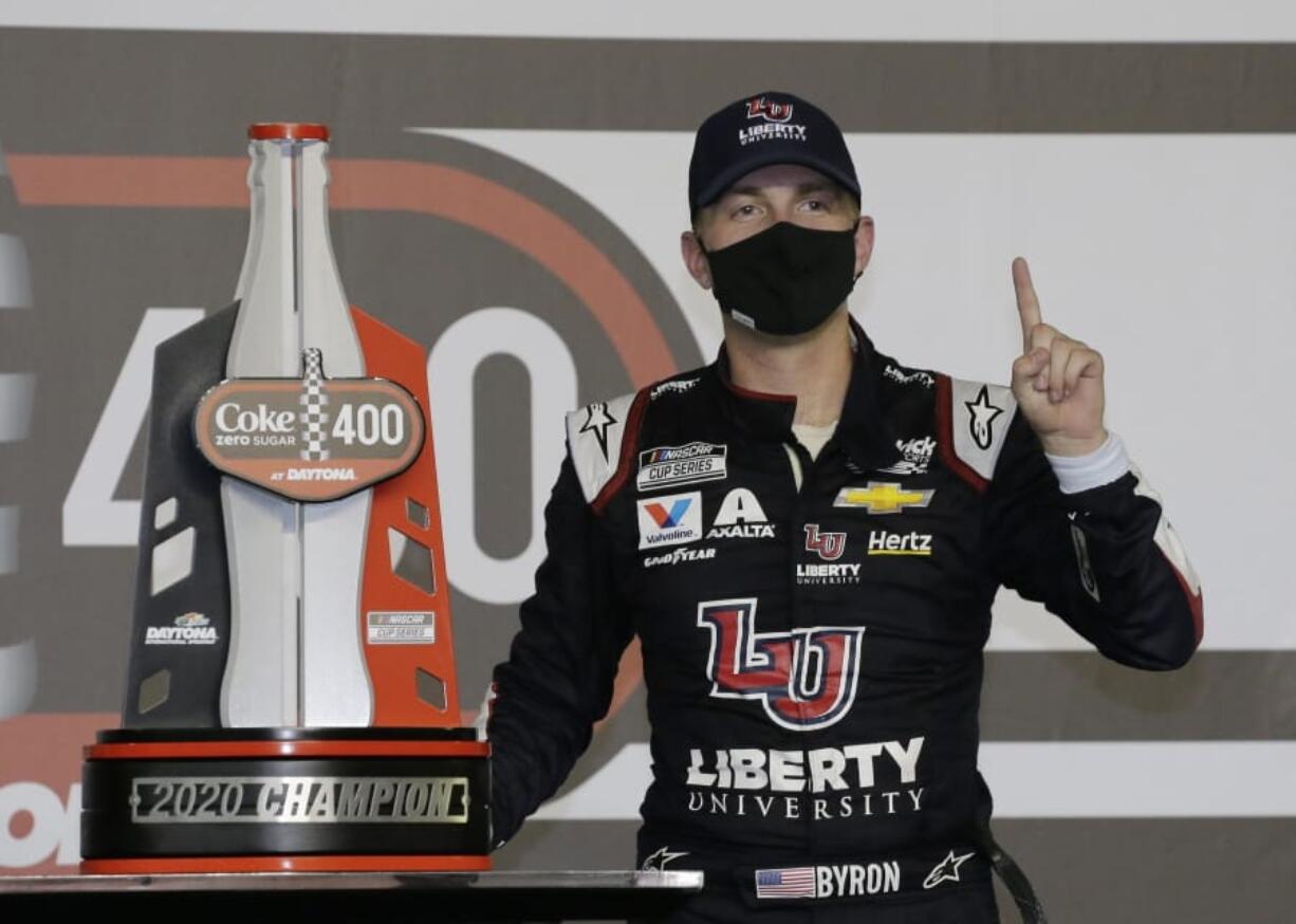 William Byron stands with his trophy in Victory Lane after winning the NASCAR Cup Series auto race at Daytona International Speedway, Saturday, Aug. 29, 2020, in Daytona Beach, Fla.