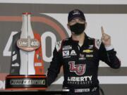 William Byron stands with his trophy in Victory Lane after winning the NASCAR Cup Series auto race at Daytona International Speedway, Saturday, Aug. 29, 2020, in Daytona Beach, Fla.