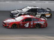 Kevin Harvick (4) races Aric Almirola (10) during the NASCAR Cup Series auto race at Michigan International Speedway in Brooklyn, Mich., Sunday, Aug. 9, 2020.