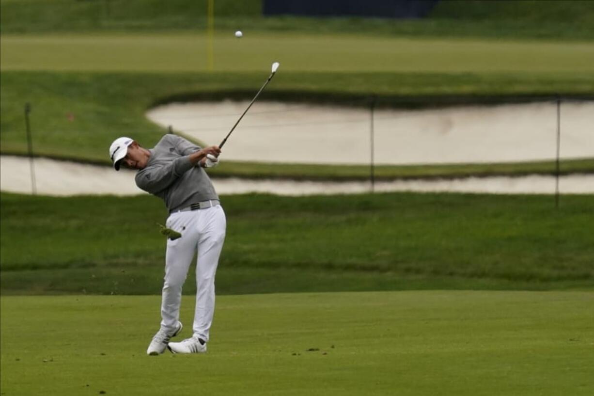 Collin Morikawa hits from the fairway on the second hole during the final round of the PGA Championship golf tournament at TPC Harding Park Sunday, Aug. 9, 2020, in San Francisco.