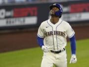 Seattle Mariners&#039; Kyle Lewis looks up as he rounds the bases after hitting a solo home run against the Texas Rangers during the first inning of a baseball game, Sunday, Aug. 23, 2020, in Seattle. (AP Photo/Ted S.