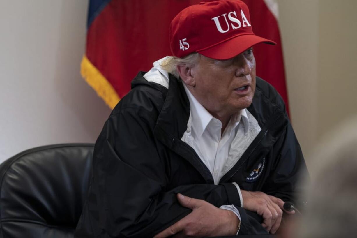 President Donald Trump speaks with state and local leaders about Hurricane Laura at the Orange County Emergency Operations Center, Saturday, Aug. 29, 2020, in Orange, Texas.