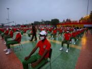 People wearing face masks and dressed in the colors of the national flag wait for the start of the Independence Day ceremony on the ramparts of the landmark Red fort monument in New Delhi, India, Saturday, Aug. 15, 2020. India&#039;s coronavirus death toll overtook Britain&#039;s to become the fourth-highest in the world with another single-day record increase in cases Friday.