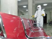 In this undated photo provided on Saturday, Aug. 29, 2020, by the North Korean government, an employee disinfects the inside of Pyongyang Station to protect against the coronavirus in Pyongyang, North Korea. Independent journalists were not given access to cover the event depicted in this image distributed by the North Korean government. The content of this image is as provided and cannot be independently verified. Korean language watermark on image as provided by source reads: &quot;KCNA&quot; which is the abbreviation for Korean Central News Agency.