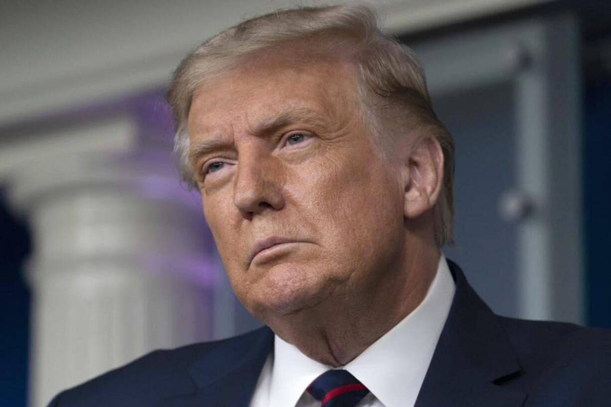 President Donald Trump pauses while speaking during a media briefing in the James Brady Briefing Room of the White House, Sunday, Aug.