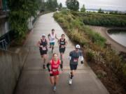 The leaders pack runs in the first half of the inaugural Apple Tree Marathon in Vancouver on Sunday, September 16, 2018.