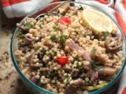 Roasted eggplant is tossed with Isaeli couscous, tomatoes, fresh herbs and a lemony tahini dressing.