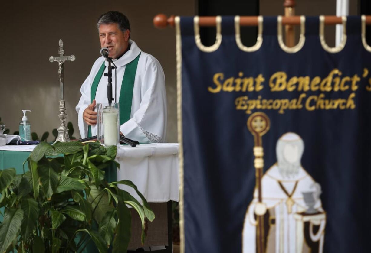 The Rev. Albert Cutie conducts church service outside St. Benedict&#039;s Episcopal Church on Sunday in Plantation, Florida as the congregation adapts to the COVID-19 pandemic. St. Benedict&#039;s Episcopal Church held drive-in movie style services as cars parked and listened on their car radios.