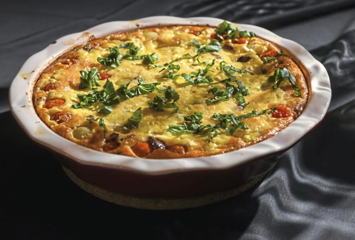 In her book, &quot;From the Oven to the Table,&quot; Diana Henry likens her clafoutis, made with tomato, goat cheese, olives and basil, to a crustless quiche. The soft and light clafoutis does really need accompaniment; it&#039;s perfect by itself.