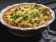 In her book, &quot;From the Oven to the Table,&quot; Diana Henry likens her clafoutis, made with tomato, goat cheese, olives and basil, to a crustless quiche. The soft and light clafoutis does really need accompaniment; it&#039;s perfect by itself.