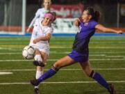 Hockinson&#039;s Kati Waggoner makes a pass as Columbia River&#039;s Andie Buckley tries to block it.