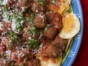 Nachos with meatballs features two crowd-pleasers packed as one hearty snack. Pork meatballs are dunked into a chunky salsa and served on cheesy tortilla chips.