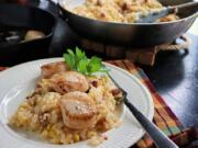 Seared scallops on top of corn and chorizo risotto is an easy and satisfying fall dish.