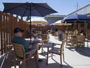 Phillip Thorgrimsen of Vancouver relaxes in the shade in the outdoor seating area at Billy Blues Bar &amp; Grill. The restaurant&#039;s outdoor seating, like most in Vancouver, heavily contributes to keeping it alive. But once foul weather rolls in, it will go away, along with seating opportunities.