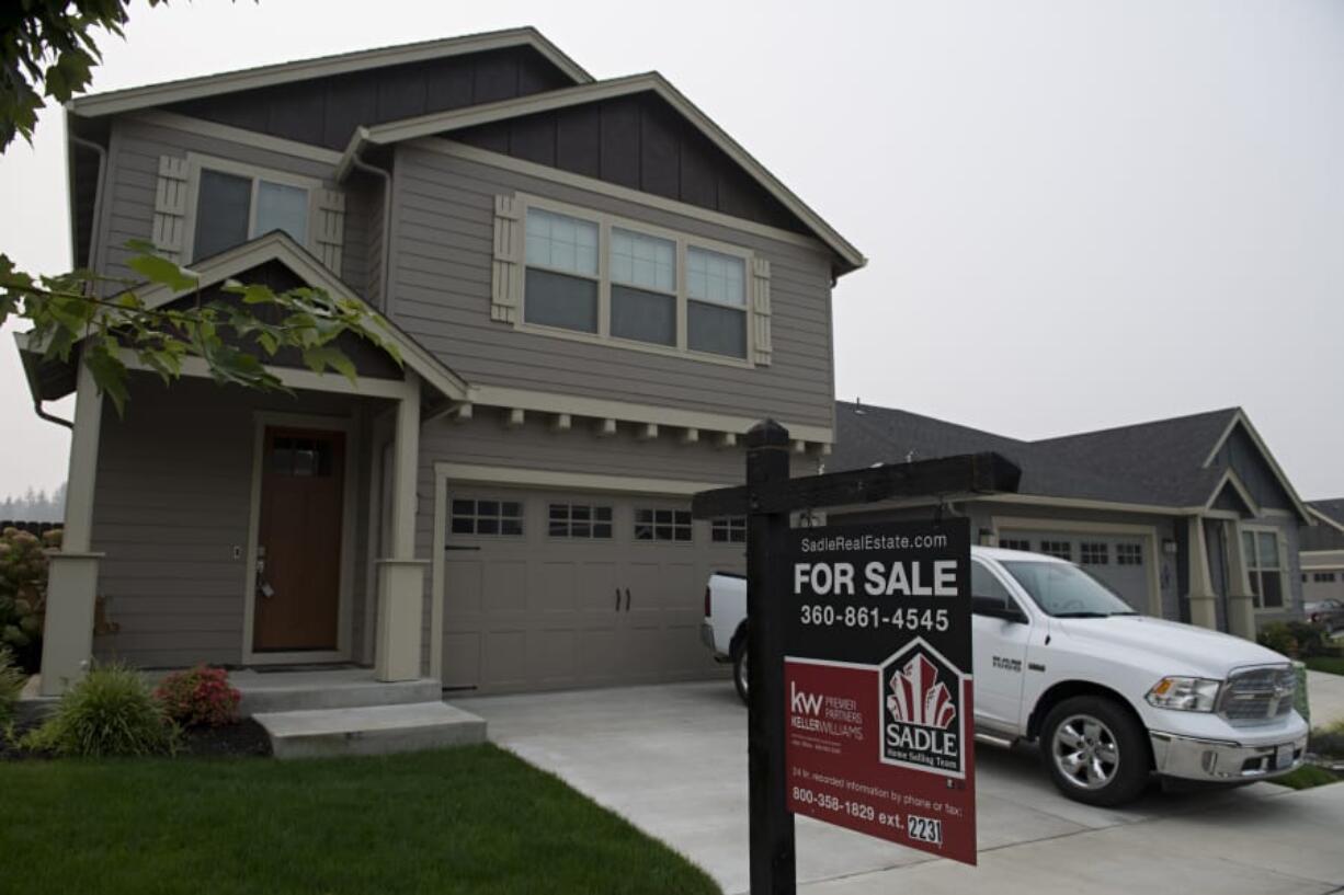 A for sale sign is posted outside a home on Northeast 133rd Way.