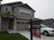 A for sale sign is posted outside a home on Northeast 133rd Way.