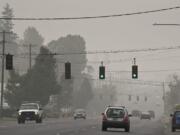 Motorists traveling on Highway 99 navigate thick wildfire smoke as it continues to choke the region.