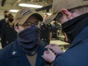 Electronics Technician (Nuclear) 1st Class Shaey Steele, from Vancouver, Washington, assigned to USS Gerald R. Ford&#039;s (CVN 78) reactor department, is pinned to his current rank during an awards at quarters ceremony, Sept. 12, 2020. Ford is underway in the Atlantic Ocean conducting carrier qualifications. (U.S.