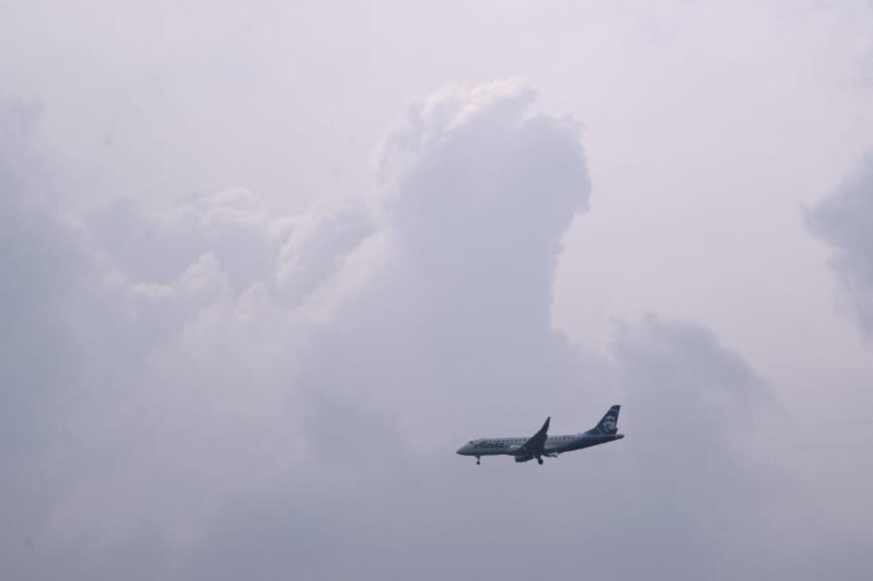 A plane visible above Washougal makes its way down to Portland International Airport. An overnight storm leading into Friday made Vancouver&#039;s air quality significantly better.