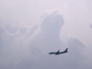 A plane visible above Washougal makes its way down to Portland International Airport. An overnight storm leading into Friday made Vancouver&#039;s air quality significantly better.