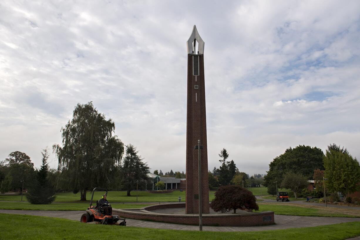 Landscape specialist Terry Flick keeps the lawn at Clark College in top shape as the campus is empty of students.