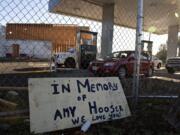 A sign honors the memory of Amy Hooser at the location of the former Sifton Market. Hooser was working an early morning shift at Sifton Market when she was killed in 2017 by Mitchell Heng, who also set the building on fire.