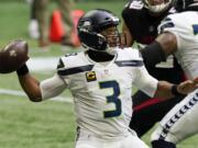 Seattle Seahawks quarterback Russell Wilson (3) works in the p[ocket against the Atlanta Falcons during the first half of an NFL football game, Sunday, Sept. 13, 2020, in Atlanta.