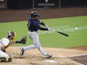 Seattle Mariners' Luis Torrens hits an RBI double during the third inning of the team's baseball game against the San Diego Padres on Saturday, Sept. 19, 2020, in San Diego.