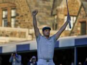 Bryson DeChambeau, of the United States, reacts after sinking a putt for par on the 18th hole to win the US Open Golf Championship, Sunday, Sept. 20, 2020, in Mamaroneck, N.Y.