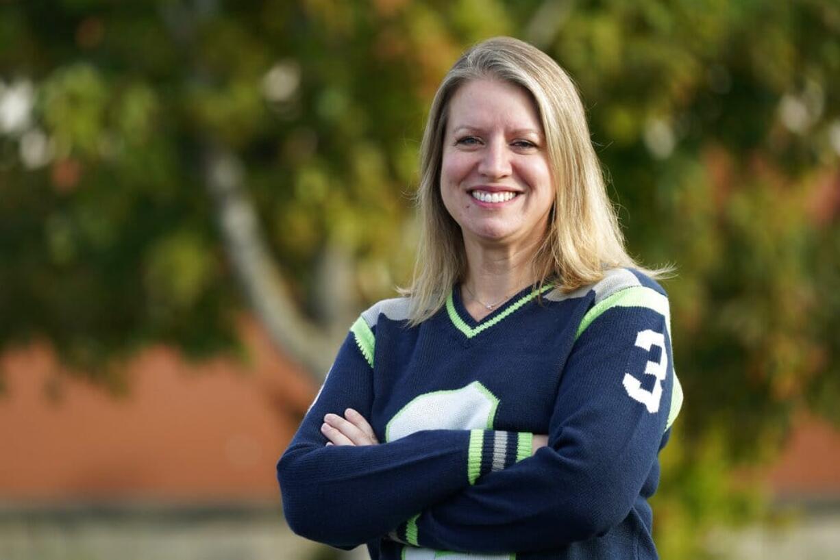 Mindi Wirth, who heads a group called Parents for Safe Schools that is seeking to overturn a sex education requirement for public schools, poses for a photo Sunday, Sept. 27, 2020, in Lynnwood, Wash. Democrats in the famously liberal state say they want to protect young people from sexual abuse, diseases and infections. But the increasingly outnumbered and aggrieved Republicans have taken issue with the content of the standards as they rally for local control. The resulting referendum on the November ballot marks the first time in the country that such a decision on sex ed will be decided by voters.