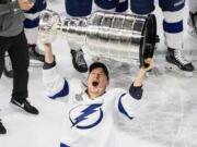 Tampa Bay Lightning's Ondrej Palat (18) hoists the Stanley Cup after defeating the Dallas Stars in Edmonton, Alberta, on Monday, Sept. 28, 2020.