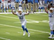 Los Angeles Chargers quarterback Justin Herbert celebrates after throwing his first career touchdown pass during the first half of an NFL football game against the Kansas City Chiefs Sunday, Sept. 20, 2020, in Inglewood, Calif.