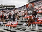 Auburn students are socially distanced as they wait for the start of an NCAA college football game against Kentucky on Saturday in Auburn, Ala.