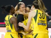 Seattle Storm forward Alysha Clark celebrates her game-winning shot with guard Jewell Loyd (24) and forward Breanna Stewart (30) during the second half of Game 1 of a WNBA basketball semifinal round playoff series against the Minnesota Lynx Tuesday, Sept. 22, 2020, in Bradenton, Fla.