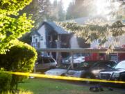 Firefighters attend to the scene of a fire at the Autumn Chase Apartments in Vancouver on Wednesday evening, July 29, 2020. Four people were injured in the fire.