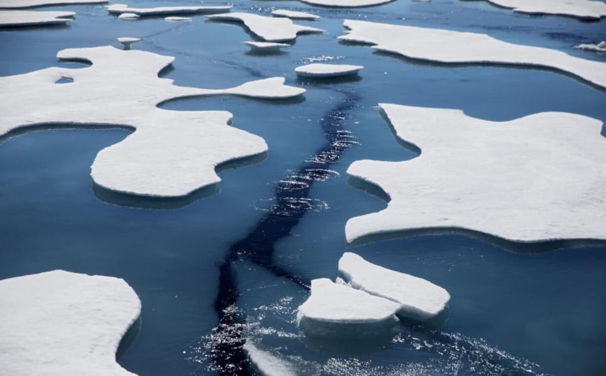 FILE - Sea ice breaks apart as the Finnish icebreaker MSV Nordica traverses the Northwest Passage through the Victoria Strait in the Canadian Arctic Archipelago in a Friday, July 21, 2017 file photo.  The National Snow and Ice Data Center&#039;s figures Monday, Sept. 21, 2020 show that sea ice last week was only 1.4 million square miles when it reached its annual low mark for the summer. In the 1980s it was always at least 1 million square miles more.