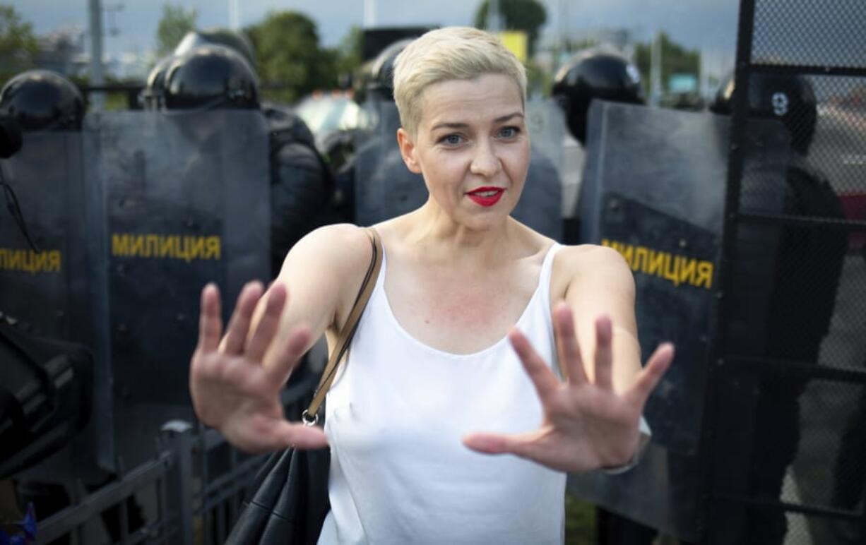 FILE - In this Aug. 30, 2020, file photo, Maria Kolesnikova, one of Belarus&#039; opposition leaders, gestures during a rally in Minsk, Belarus. Kolesnikova, a professional flute player with no political experience, emerged as a key opposition activist in Belarus. She has appeared at protests of authoritarian President Alexander Lukashenko after he was kept in power by an Aug. 9 election that his critics say was rigged.