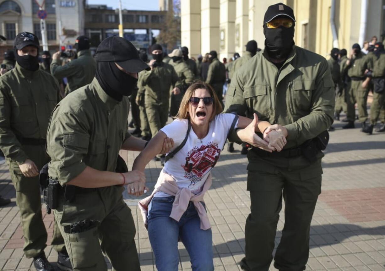 Police detain a protester during an opposition rally to protest the official presidential election results in Minsk, Belarus, Saturday, Sept. 26, 2020. Hundreds of thousands of Belarusians have been protesting daily since the Aug. 9 presidential election.