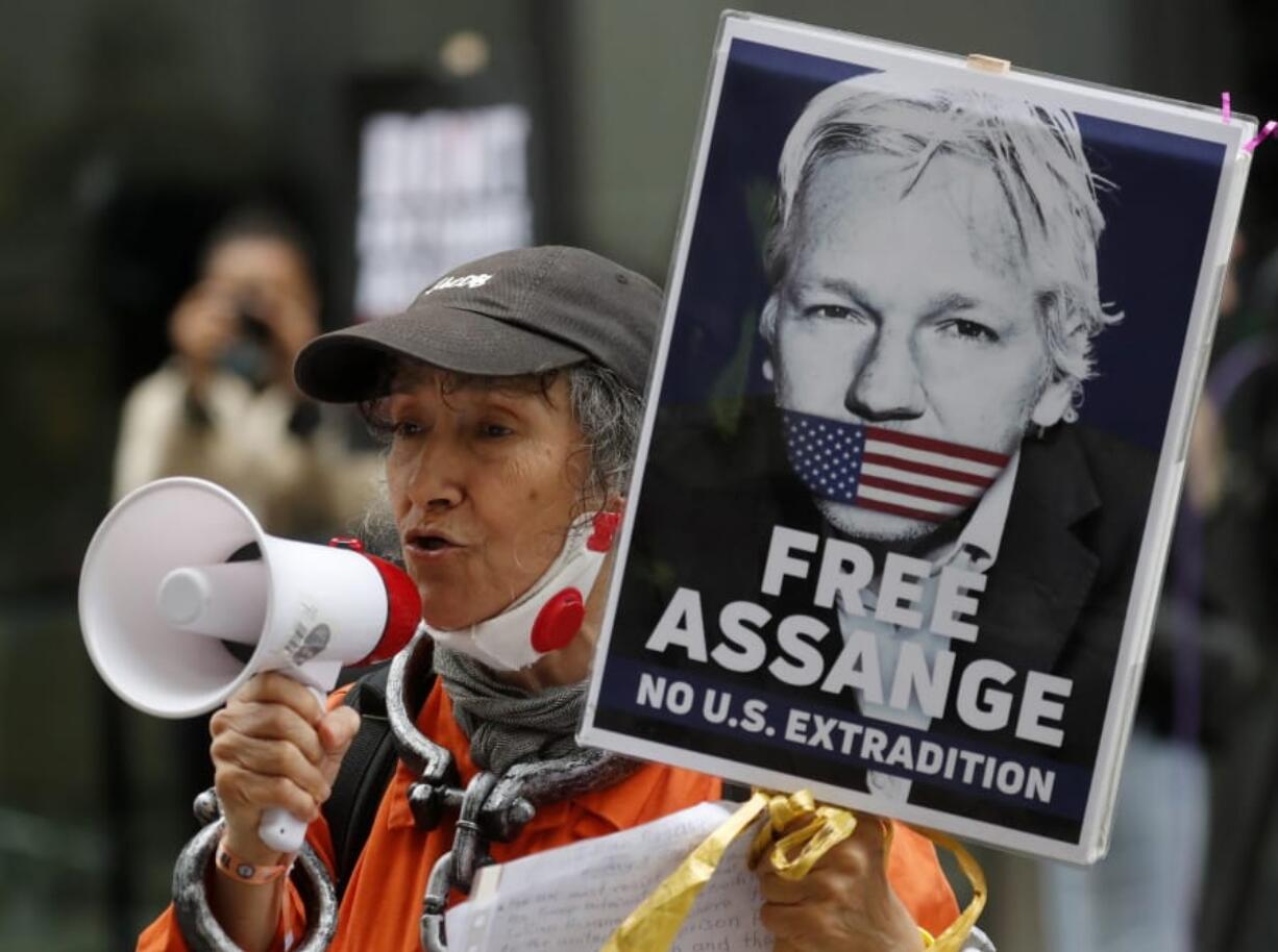 Julian Assange supporters protest outside the Old Bailey in London, Monday, Sept. 7, 2020. Lawyers for WikiLeaks founder Julian Assange and the U.S. government were squaring off in a London court on Monday at a high-stakes extradition case delayed by the coronavirus pandemic. American prosecutors have indicted the 49-year-old Australian on 18 espionage and computer misuse charges over the WikiLeaks publication of secret U.S. military documents a decade ago. The charges carry a maximum sentence of 175 years in prison.