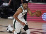 Milwaukee Bucks&#039; Giannis Antetokounmpo (34) in the second half of an NBA conference semifinal playoff basketball game against the Miami Heat Friday, Sept. 4, 2020, in Lake Buena Vista, Fla. (AP Photo/Mark J.